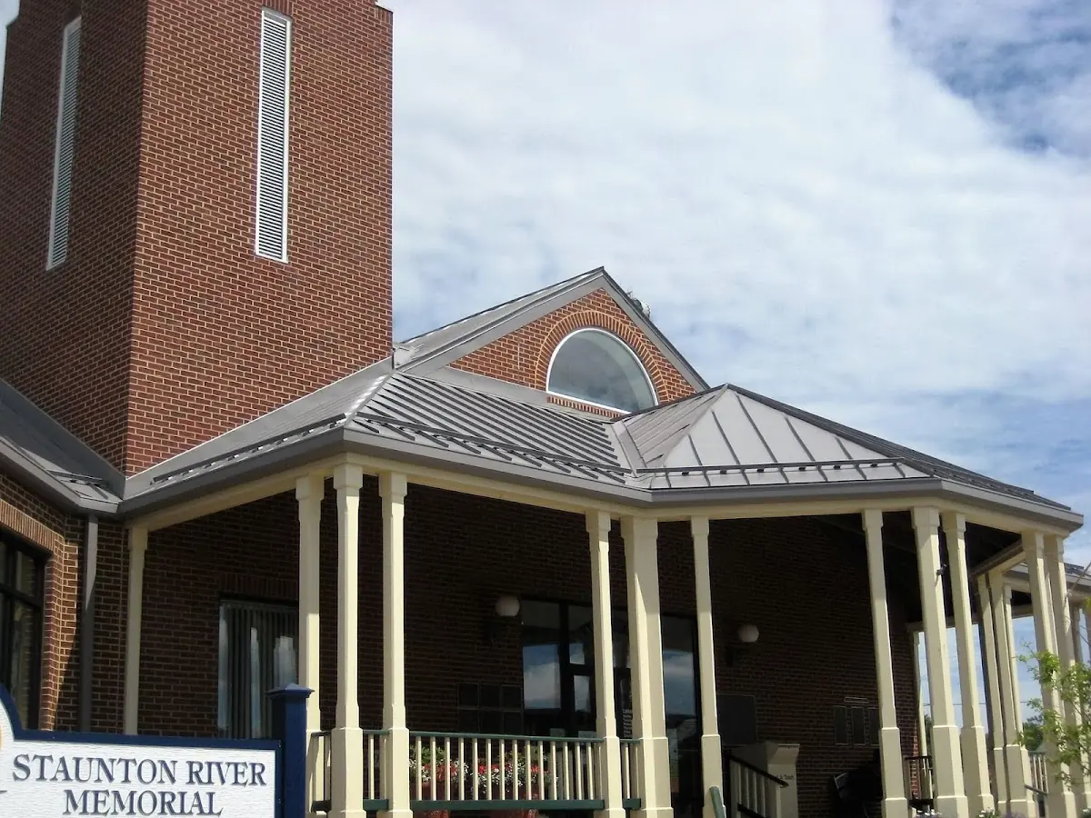Skilled roofing craftsmen working on a residential roof in Ashville
